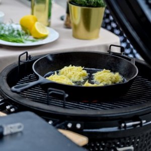 Grated potato pancakes with cottage cheese cream and herring grate